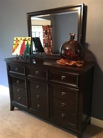 Beautiful dark cherry 9 drawer dresser and mirror.