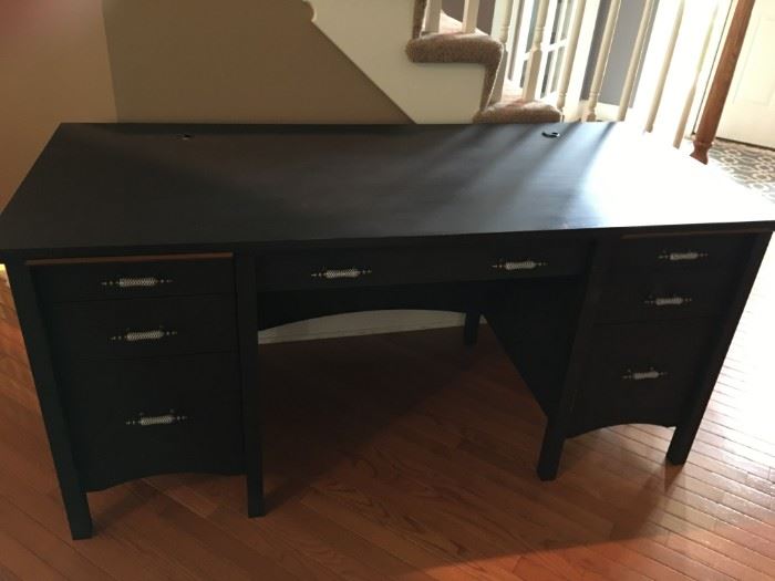 Distressed black painted office desk with adorable ceramic handles.