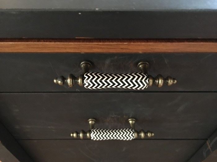 Distressed black painted office desk with adorable ceramic handles.