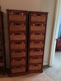 2 wood shelving units with wicker and wood baskets. Approx 5 1/2 feet tall.