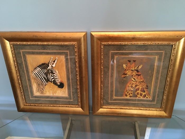 Gorgeous framed zebra and giraffe prints.