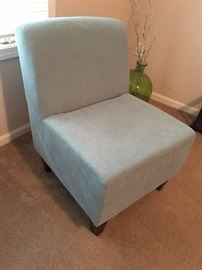 Two very cute light blue upholstered chairs.