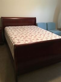 Queen sleigh bed, linens and mattress & box.