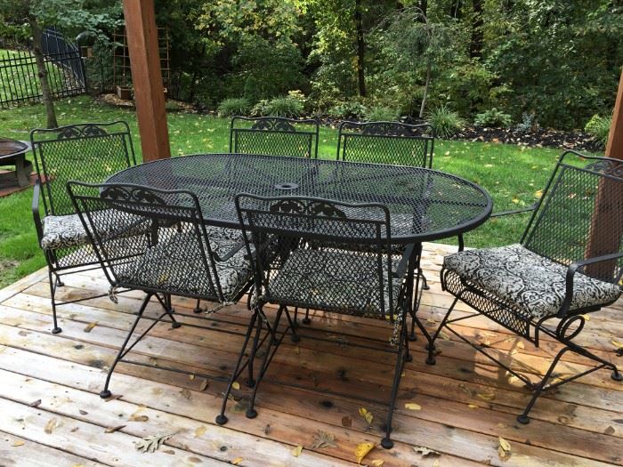 Wrought iron patio table and 6 rocker chairs in excellent condition!