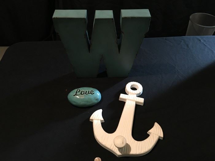 Metal "W", wood anchor and ceramic "love" stone.