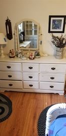 white wooden chest of drawers with mirror