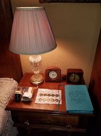 Lamp, coins, alarm clocks