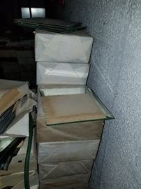 Boxes and boxes of mirror tiles in 2 sizes