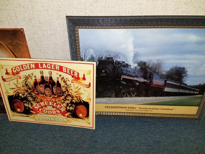 Tin advertising signage. Framed train art