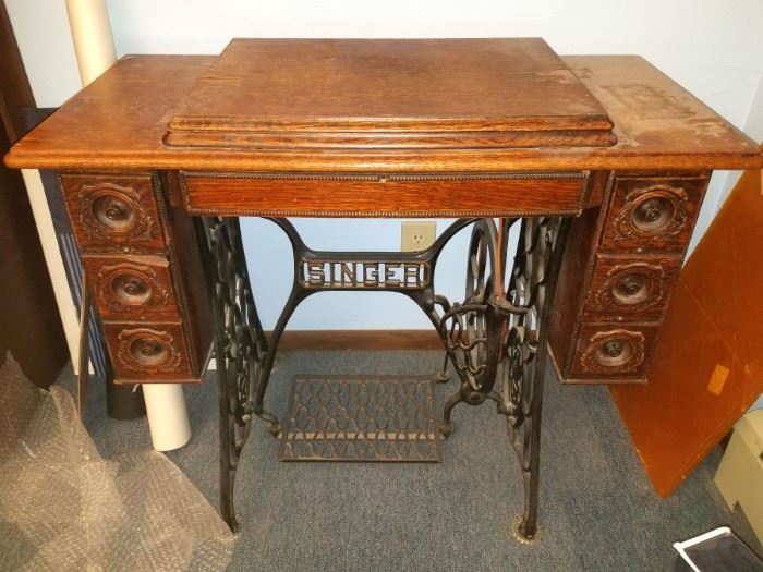 Antique Singer sewing machines with cabinets