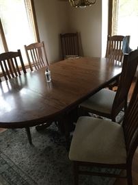 Beautiful Amish made table with 6 leaves and 8 chairs