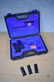 Plastic gun case with magazines and grips / 2 magazines (.40S&W-.357 sig), 3 grips. LOCATION 17
