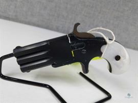 Sport-Arms revolving double barrel derringer in 22LR / Sport-Arms revolving double barrel derringer in 22LR; Black with pearl handle; This type of weapon first appeared circa 1860: a two barreled derringer with a third central barrel that's really an axle. A great little 22LR to add to your collection. FFL# 279
