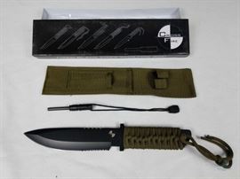 Cross Fire Knife with Fire Rod / Green Cord Wrapped Handle with Green Nylon Sheath. 6.5' Black Stainless Steel Blade. New in Box. LOCATION 20
