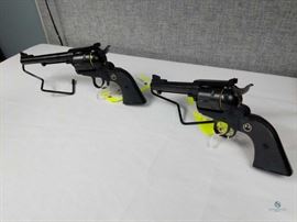 Ruger New Model Blackhawk and Ruger Commemorative Pistol 1956-2006 .44 Mag / In Glass Display Case - Ruger Commemorative Pistol - 1955-2005 50th year. Black finish with gold lettering. Does not appear to have been fired. Excellent condition. Includes hard plastic case and all original paperwork. 520-09727 .357 Magnum, FFL #269 AND Ruger Commemorative Pistol - 1956-2006 .44 Magnum. Black finish with gold lettering. Does not appear to have been fired. Excellent condition. Includes hard plastic case and all original paperwork. 870-09727 .44 Magnum, FFL #268
