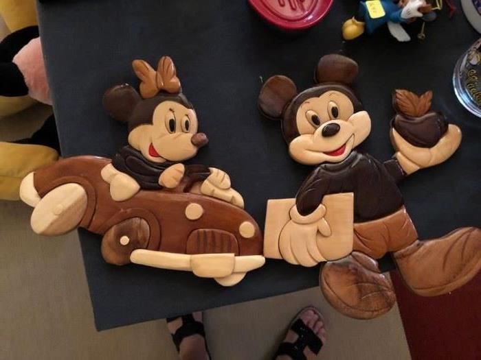 Wooden cutouts of Mickey and Minnie Mouse
