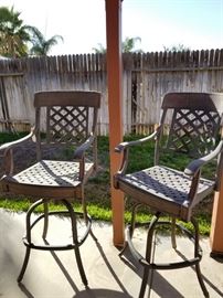 Metal bar stools in yard 