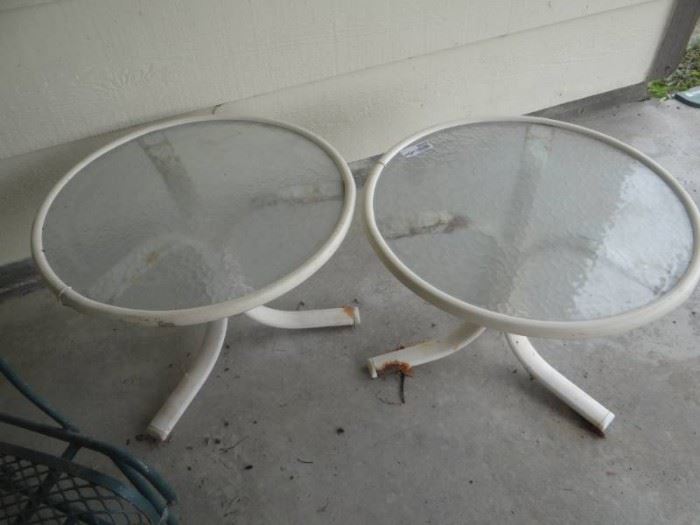 2 Outdoor small tables metal base glass top.