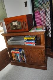 Tv cabinet, collection of VHS and Crosley combination player - radio, CD, record 