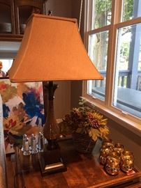 Home decor lamps, napkin rings and floral arrangements