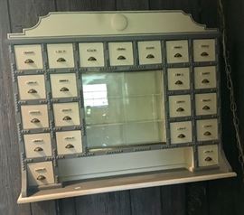 German wall hanging cabinet with porcelain pulls