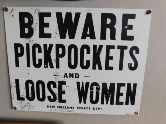 Beware of pickpockets and loose women sign 