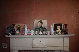 Antique Figurines, Portraits, Prints, and Vases adorn this original fireplace mantle from this fine home built in 1815