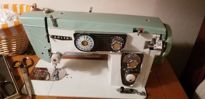 vintage adler sewing machine in cabinet