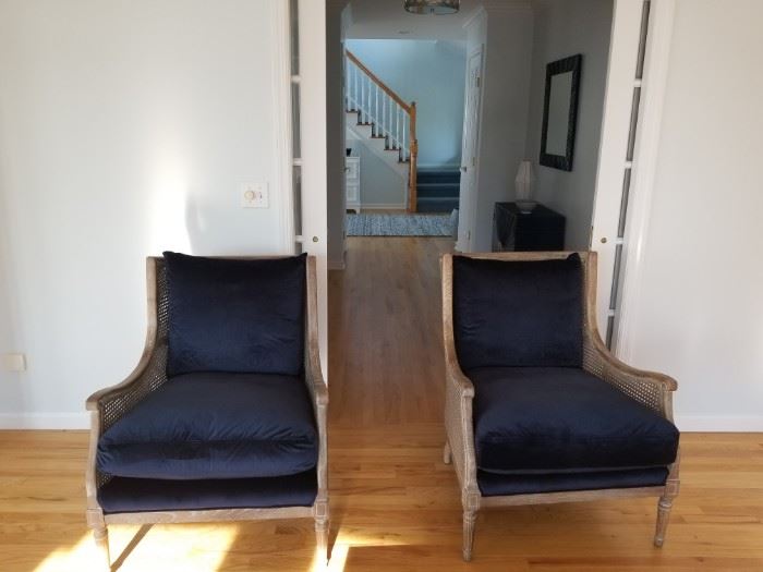 2 limed light brown wood wing chairs with caned sides & backs, navy velvet cushions.  29Wx26Dx35H  $900 ea