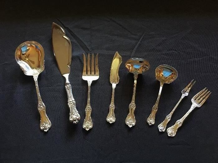 Matching sterling silver flatware set serving utensils