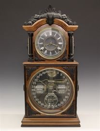 Ithaca No. 3 1/2 Calendar Shelf Clock - A late 19th century Ithaca No. 3 1/2 Calendar shelf clock. 8-day time and strike movement with lower calendar mechanism, original Black upper and glass lower dials, original pendulum with "I C C Co" glass insert. Walnut case with carved crest ebonized columns and applied decoration on a molded base. Cleaned original finish with some wear, carved crest an accurate replacement, small edge flake in pendulum insert. Running when cataloged. 20 1/2" high.