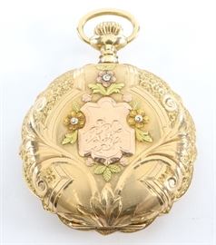 Elgin 14k multi Gold Pendant Watch - 6 size, 7 j, DMK, SW, PS, Fancy Solidarity 14k multi Gold, HC, SSD w/Arabic numerals. Serial #13507683. 52.7 grams total weight. Slight wear, monogram on front cover. Winds, sets and running when cataloged.