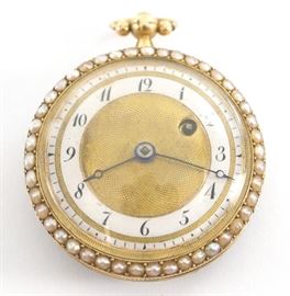 A French 18k Gold ladies pendant watch with seed Pearl bezels and enameled rear cover. 35mm, KW (through the dial), KS, 18k Yellow Gold, OF, Gold engine turned dial w/Arabic numerals on a porcelain chapter ring. Serial # 27794. 26.1 grams total weight. Some wear, lacks one pearl on rear cover. Winds, and sets, not running when cataloged.