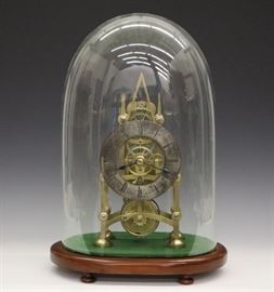 T C Savory Skeleton Clock - A 19th century Skeleton clock by "T(homas) Cox Savory, 41 Cornhill, London, No. 411". 8-day time only fusee driven movement with a Silvered chapter ring and skeletonized brass plates. Mahogany base with turned feet and blown glass dome. Slight wear to dial, base refinished and re-felted. Running when cataloged. 16" high overall.