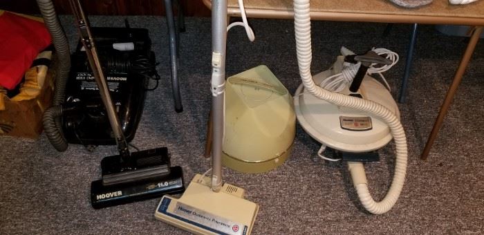 Working  canister vacuums and a vintage hair dryer