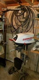 Vintage 1960's Evinrude 18. Complete throttle and steering cabling. Also showing is a trolling motor (Silencer 425)