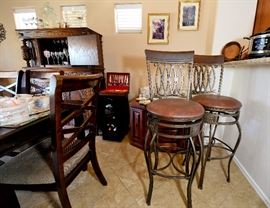 Two bar height swivel stools for sale.