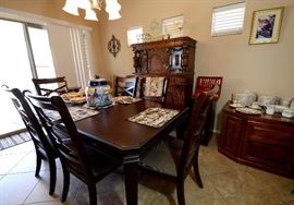 Ashley Dining Set with 6 chairs. It has a leaf and custom table pad. Receipt also of original cost.