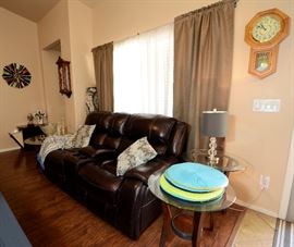 Brown Sofa that rocks and reclines with electric USB port.