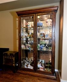 Lighted and Mirrored Curio Cabinet.