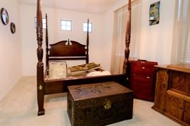 Gorgeous Queen Poster Bed for sale. The hand carved chest at the end of the bed is to die for! Unusual locking mechanism.
