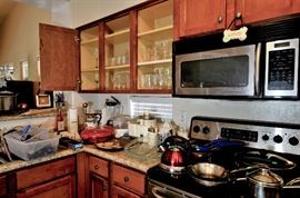 Colored Glassware and pots and pans and small appliances for sale.