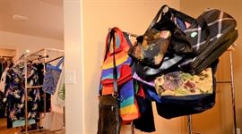 Lots of colorful purses for sale. A lot more that is not shown. Shoes too! And plenty of clothes new with tags.