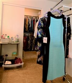 Lots of clothes with tags still on. This dress has a retail tag of $98.00.