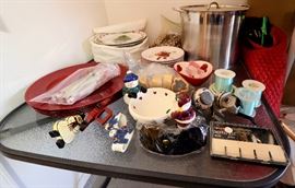 Christmas dishes and fishing reels and related items for sale.