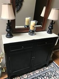 2 lamps, candle, cabinet, rug