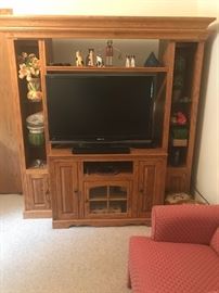TV console (not the TV) There is another smaller TV for sale