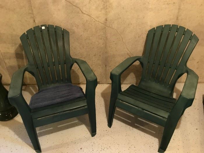 A pair of heavy duty plastic lawn chairs