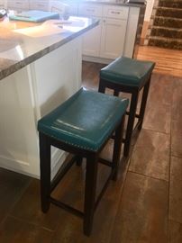 FOUR  teal leather island stools 