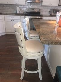 FOUR  white leather counter chairs 